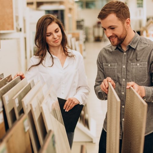 two people browsing flooring products - USA Carpets in GA